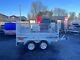 Brand New 8,2ft X 4,3ft Twin Axle Trailer With 60cm Mesh And Ramp 1300kg Braked