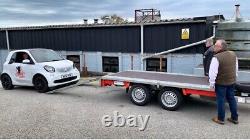 Brian James twin axle car trailer with side walls, car ramps, tie downs