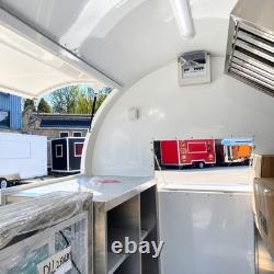 Compact White Twin Axle Mobile Catering Trailer Rounded Pod Dual Serving Hatches