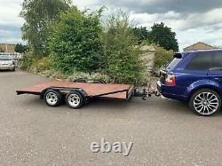 Flat bed twin axle trailer with electric and brakes