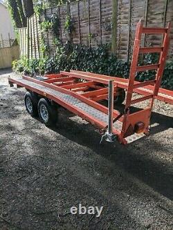 Tilt bed twin axle beavertail car transporter trailer with winch. FITS IN GARAGE