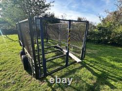 Trailer Twin Axle 10ft X 5.5 Ft Unbraked Mesh Sides And Ramp. Needs floor board