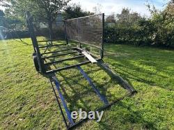 Trailer Twin Axle 10ft X 5.5 Ft Unbraked Mesh Sides And Ramp. Needs floor board