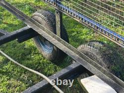 Trailer Twin Axle 10ft X 5.5 Ft Unbraked Mesh Sides And Ramp. Needs floor board