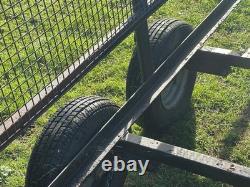 Trailer Twin Axle 10ft X 5.5 Ft Unbraked Mesh Sides And Ramp. Needs floor board